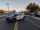 Mother killed in Lawrence after getting pinned by vehicle while trying to attend to infant child