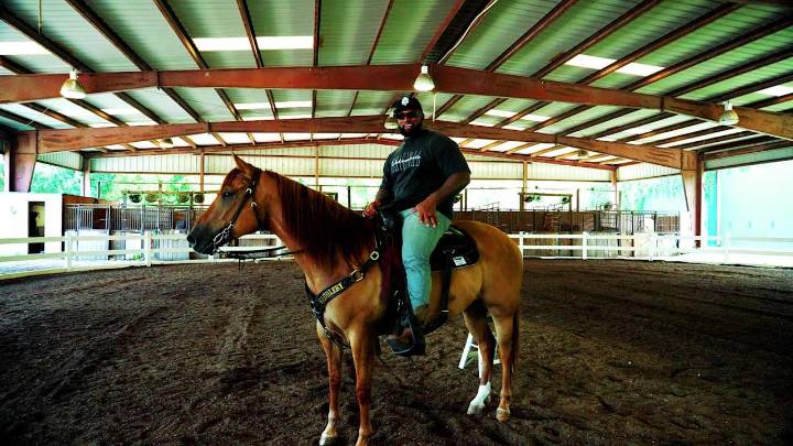 New Orleans Saints defensive tackle Davon Godchaux finds peace on horseback off the field