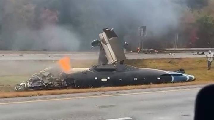Plane crashes on Massachusetts highway in heavy rain, killing 2 and injuring 1