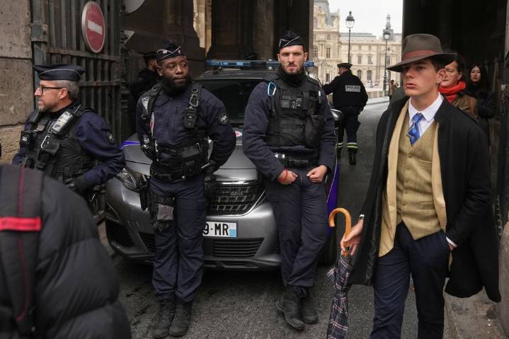 Inspector Clouseau? The mystery man in an AP photo after the Louvre jewel heist creates a buzz