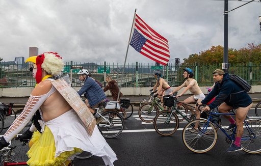 Naked bike riders demonstrate against federal troops in 'quintessentially Portland' protest