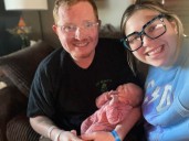 Dad brings newborn into the world on side of Aurora road