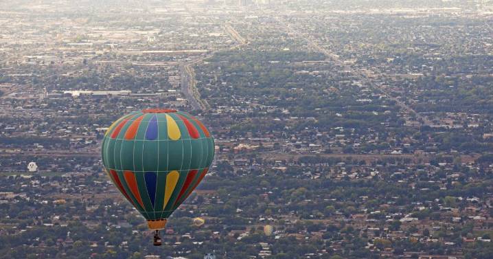 Hot air balloons float above Albuquerque during the International Balloon Fiesta