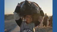 Thousands of Palestinians return to what's left of their homes as Gaza ceasefire takes effect