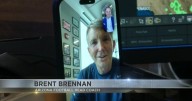 U of A football coach checks weekend game forecast from Brode