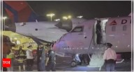 Two Delta planes collide while taxiing at LaGuardia Airport in New York; wing of one plane detached