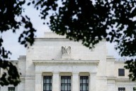 Analysis-Foreign investors can exploit cheaper dollar hedges as Fed easing resumes