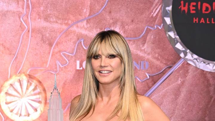 Heidi Klum braves the New York rain in vampy all-leather look for Halloween event