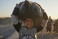 Thousands of Palestinians return to what's left of their homes as Gaza ceasefire takes effect