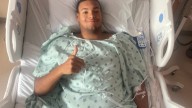 Injured high school football player JaQuar Johnson resting has use of extremities