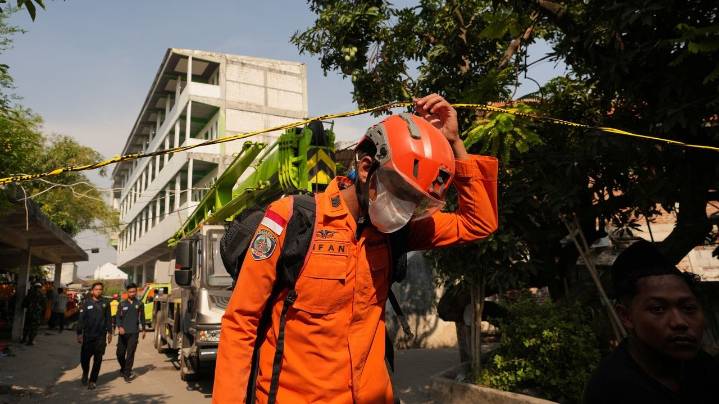 Death toll from Indonesian school collapse rises to 14 as crews pull more bodies from rubble