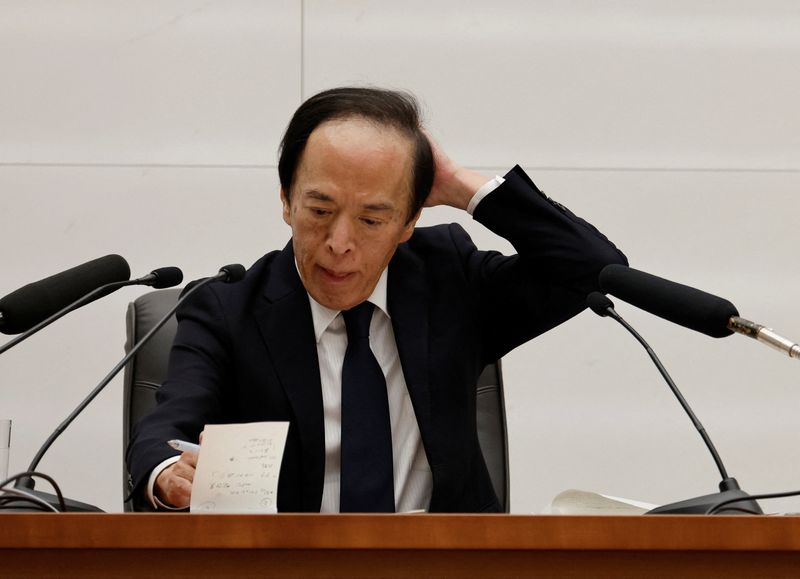 BOJ holds rates steady, keeps future hikes in view