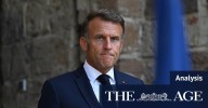French President Emmanuel Macron wanders alone by the Seine as his grip on power slips away