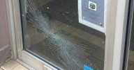 Midlothian shop owner issues plea after front door 'kicked in' and glass smashed