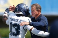 UConn celebrates Jim Mora's 100th win as head coach