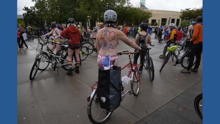 Naked bike riders demonstrate against federal troops in 'quintessentially Portland' protest