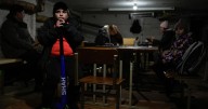 Photos show Ukrainians dealing with blackouts as Russia strikes energy infrastructure
