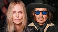 Charlize Theron Seemingly Gives Cold Shoulder to Johnny Depp at Dior Show