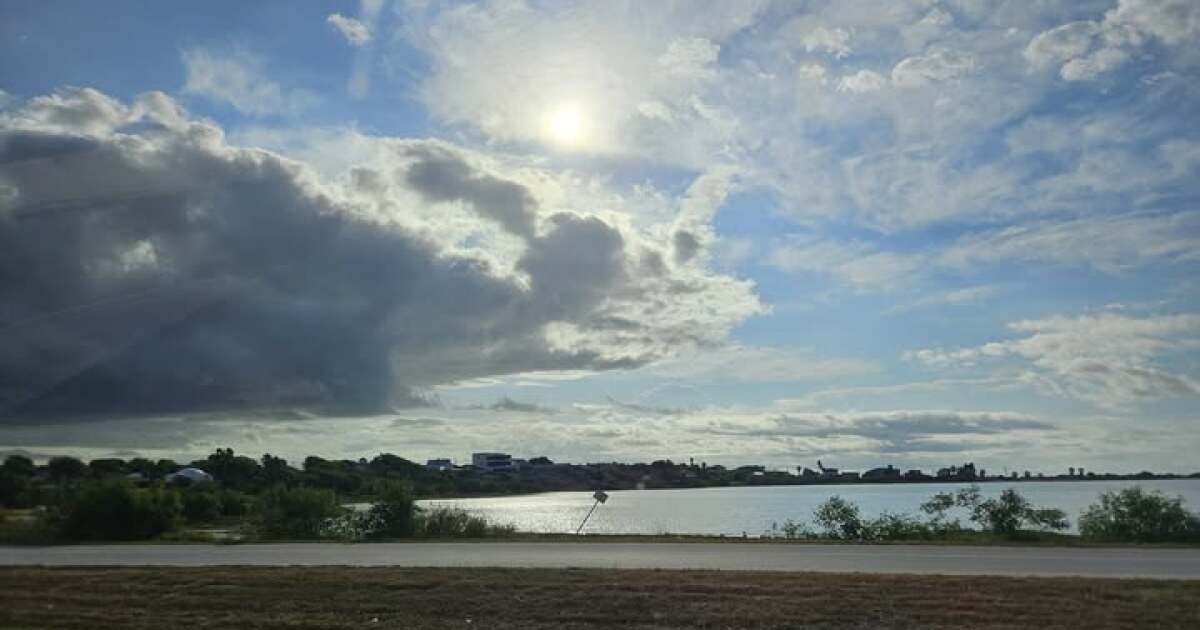 Quiet evening after some passing showers, gloomy skies, and gusty winds
