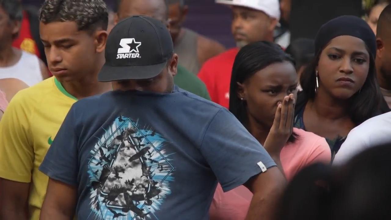 Brazilians in a Rio favela line up bodies after the city's deadliest police raid