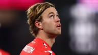 Collingwood coach Craig McRae speaks to Sydney midfielder James Rowbottom during trade period