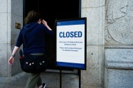 Government shutdown takes hold with mass layoffs looming and no end in sight