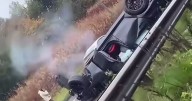 Horror pictures after car is smashed into road sign and flipped onto roof