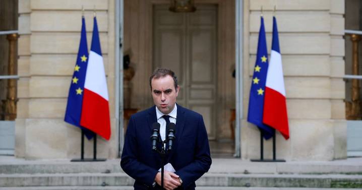 France's re-appointed prime minister calls for calm