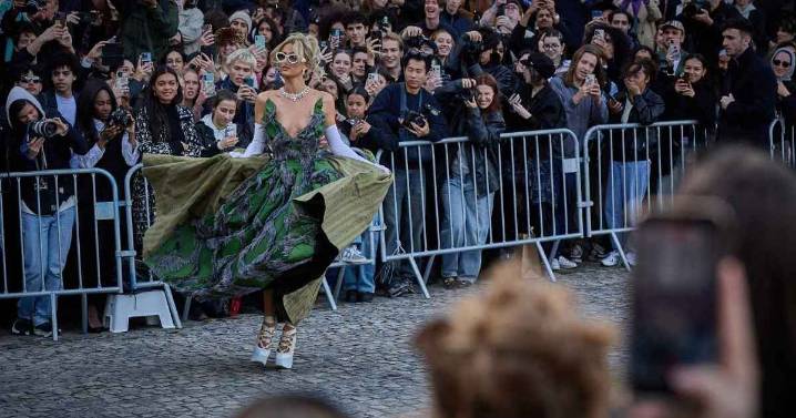 Paris Hilton Spreads 'Pure Magic in Paris' in Photos Wearing Feathered Gown