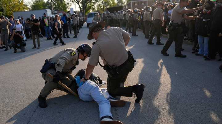 Protesters at ICE facility object to barricades, agents detain multiple people