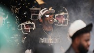 Colorado fans storm field after win over No. 22 Iowa State, Deion Sanders loves it but fine may loom