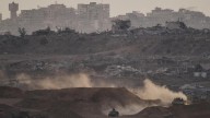 Israel delays aid after slow Hamas return of bodies