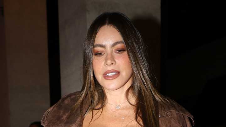 Sofia Vergara nearly busts out of plunging leather dress as she struts out of luxe Paris hotel for fashion week