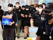 Dozens of South Koreans freed from Cambodia scam centres now home, arrested