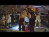 Firefighters rescue woman from manhole