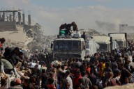 Israel Says It’s Halving Aid Into Gaza After Receiving Last 20 Living Captives