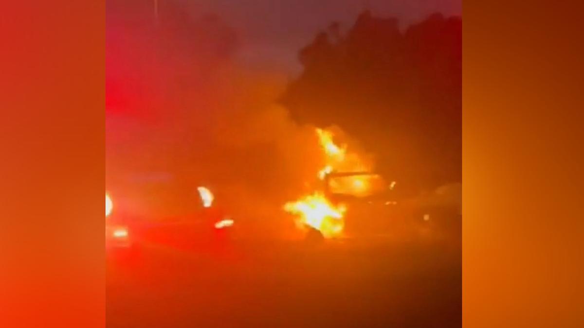 Emergency crews rush to scene of fiery crash after car collided with motorbike on West Coast Highway