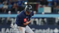 Watch Mariners player jump in front of throw in strange Game 7 play