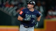Mariners fan sporting ‘Dump 61 here’ shirt catches homer, meets Raleigh