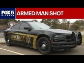 Armed man killed by deputies, mother dead in house, police say