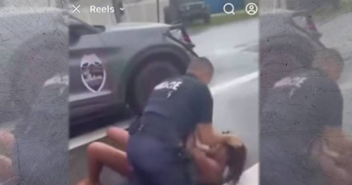 Altercation between parent and police officer over school parking caught on camera