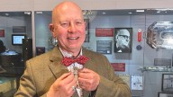 Bow tie lover John Northcott tries on Joey Smallwood’s famous fashion accessory