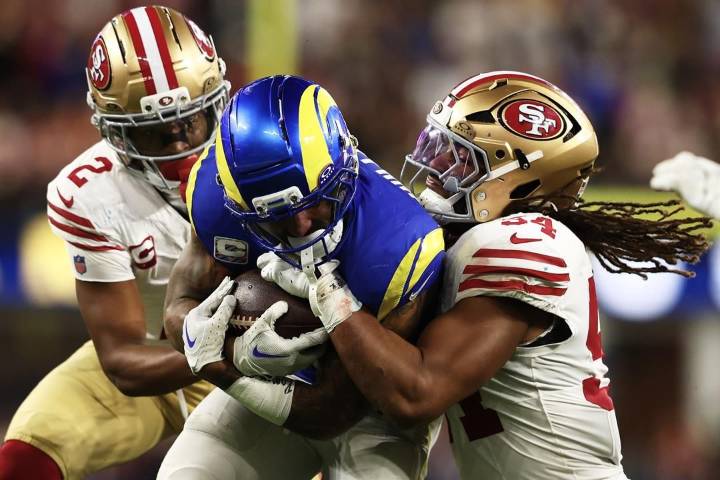 Short-handed 49ers stop Rams on downs in overtime, preserving a 26