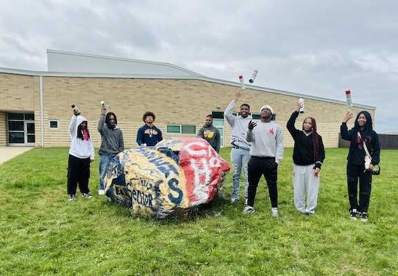 Chaney, East High School students paint 'unity boulder' to celebrate merger