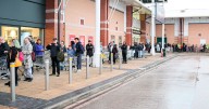 Shoppers queue up more than four hours early for opening of new Bolton store with lure of ‘supermarket sweep’ run