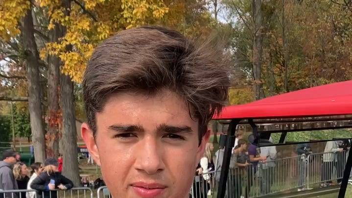Woodridge's Atticus Sloan reacts to runner-up finish at regional meet