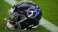 Who will be the Titans' interim head coach?