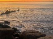 Warm and dry weekend ahead for Staten Island, showers possible mid