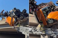 Tow Truck Driver Rescued After Crash Leaves Him Dangling Off Overpass