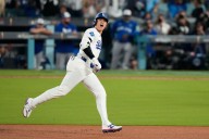 Ohtani hits 2 homers, ties record with 4 extra